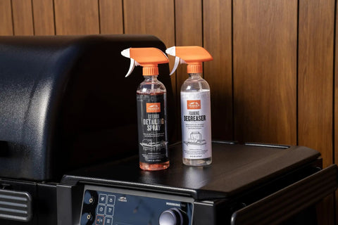 Heavy Duty Grill Cleaning Kit With Exterior Detailing Spray And Foaming Degreaser Bottles on Grill