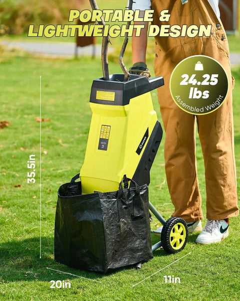 Corded Electric Wood Chipper Shredder with 15 Amp Motor and Collection Bag in use on grass