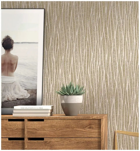 Moonlight Forest Glitter Textured Wallpaper With Flocking, Extra Thick Vinyl Coated in taupe khaki gold, on accent wall with wood dresser.