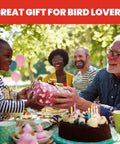 Family enjoying outdoor gathering with gift and cake, suitable for bird lovers, featuring Bird Health Plus Big Gulp Hummingbird Feeder gift.