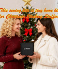 Two women exchanging a Grab And Go Portable DIY Sewing Kit For Travelers And Beginners Black Size Small against Christmas backdrop.