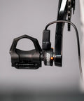 Close-up of left pedal power meter for road bikes with single sensing pedal bluetooth and ANT plus connectivity for bike computers GPS units and smartphones easy to install and move between bikes.