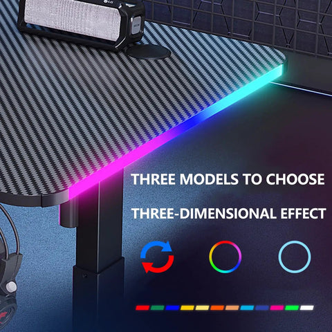 Adjustable Height Standing Desk With Carbon Fiber Top And Hella Fast Electric Lift Offers Chill Work Mode Programmable Memory Presets Cool Rgb Lighting showing RGB effects on the edge.