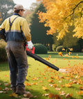 Man using Cordless Leaf Blower With 18V Battery Compatibility 450 CFM Airflow And 130 MPH Speed Copper Motor Handheld Yard Cleanup Tool Dope Performance Battery Not Included Red blowing autumn leaves in park