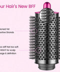 Close-up of Upgraded Large Round Brush Attachment for Dyson Airwrap with cushioned strands and rose color detailing.