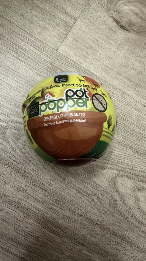 Pot Popper Organic Insect Control With Beneficial Nematodes For Container Plants packaging on wooden surface.