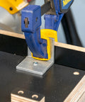 Professional Grade Miter Saw Jig Delivering Dead Nuts Accurate Cuts Without Any Sweat Featuring Its Rock Solid Angle Guiding Mechanism close-up of angle clamp on jig