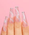 Shimmery nails featuring Cat Eye Gel Nail Polish Set HEMA Free Cruelty Free Vegan Soak Off UV LED Gel Manicure Kit For DIY Nail Art 6 Colors 10ml Bottles With Safe Formula And Long Lasting Shine on fingers against pink background.