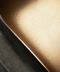 Close-up of the elegant gold interior of the USZWBY Vessel Sinks Bathroom Sink, Art Ceramic Rectangular Vessel Basin Vanity.