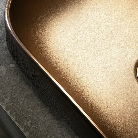 Close-up of the elegant gold interior of the USZWBY Vessel Sinks Bathroom Sink, Art Ceramic Rectangular Vessel Basin Vanity.