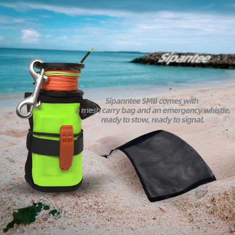 DSMB Kit For Scuba Diving With Five Foot Tube And Ninety Eight Foot Reel Marker Buoy on sandy beach with mesh carry bag