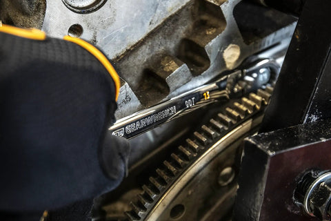 10mm Flex Head Ratcheting Wrench, 12 Point, Swing Arch Design in use on machinery, highlighting tight space access and secure grip