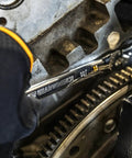 Mechanic using 21mm 4 Degree Swing Arch 12 Point Flex Head Ratcheting Combination Wrench For Tight Spots in engine work