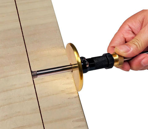 Precision Dovetail Jig And Wheel Marking Gauge Set Featuring Smooth Micro Adjustments For Dead On Depth Measurement Includes Extra Cutters Sharp Pencil And Heavy Duty Anodized Aluminum Base Killing It On Fine Woodwork Projects Daily, close-up of marking gauge adjusting depth on wood.