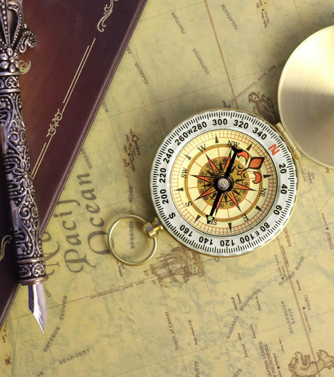 Waterproof Brass Compass For Hiking And Survival With Large Dial And Glow In The Dark Markings on vintage map background