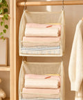 Premium Hanging Closet Organizer With Ultra Soft Fabric Shelves designed as a slick space saver displaying neatly folded towels.