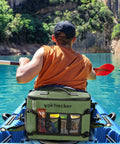 Kayaker with waterproof kayak cooler bag with seat back design on a sunny day in clear blue water