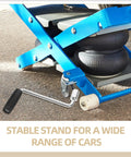 Camper Crank Handle Replacement For RV Trailer Jack Sockets Hand Crank Rocker next to blue jack stand in use on pavement