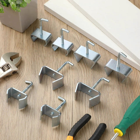 4 Pack 1-1/4 Inch Bed Frame Rail Clamps And Connectors Heavy Duty Zinc Plated Hardware on wooden surface with tools.