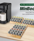 Coffee station with Step Shaped Bamboo K Cup Holder Duo For Your Coffee Station Drawer Or Countertop Organizer Holds 30 Pods Two Piece Set With 3 Tiers For Easy Access And Clutter Free Counter Space Eco Friendly Durable Build holding pods next to a coffee machine.