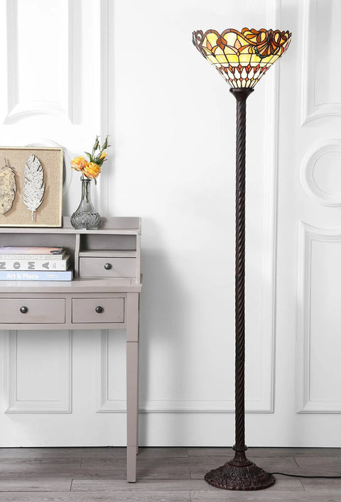 70 Inch Bronze Tiffany Style Stained Glass Torchiere Floor Lamp With Handcrafted Iron Stand next to a light grey desk