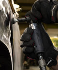 Compact Right Angle Pneumatic Die Grinder With 1/4 Inch Collet And 20000 Rpm Motor Built Like A Tank For Tight Spaces And Heavy Duty Grinding Cutting Or Polishing Jobs No Nonsense Workhorse For Auto Fabrication Trades in use on metal surface.