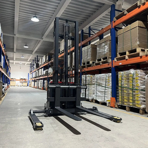 Mechmaxx 3300 Lb Electric Lithium Ion Straddle Stacker With 98 Inch Lift Height And Adjustable Legs Forks 24V Battery Industrial Pallet Handler For Warehouses in warehouse aisle.