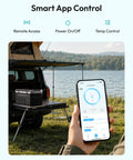User controlling 22Qt Portable Car Fridge And Freezer With Dual 12V Dc And 110V Ac Plugs via smartphone app outdoors.