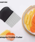 Rainspire Crinkle Cutter for Veggies, black-handled stainless steel blades, side view.