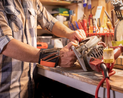 Person using a circular saw wearing Magnetic Wristband For Holding Screws Nails And Drill Bits With 10 Strong Magnets Adjustable Tool Bracelet
