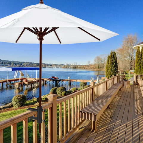 Heavy Duty Patio Umbrella Clamp Mount For Deck Railings And Outdoor Furniture shown securing umbrella on wooden deck by lake