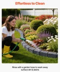 Person cleaning garden bordered by Faux Stone Landscape Edging Kit 15.5 Ft No Dig Border For Lawn And Garden Beds With Realistic Texture 4 Pack Of Sections Each With Six Bricks 46.85 In Long Includes 8 Spikes using a garden hose, showcasing its no-dig feature.