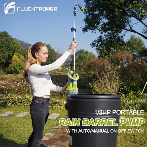 Woman using Beast Mode 1/2 HP Submersible Rain Barrel Pump With Float Switch 1050 GPH 26 Ft Cable in garden with rain barrel