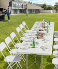 Six Foot Folding Table For Indoor Outdoor Use, Portable Long Rectangular Table with white top, set for a garden party