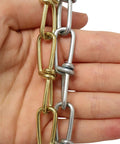 10 Gauge Decorative Solid Steel Double Loop Chain Sold By The Reel, 164 Feet, showing close-up of chain links held by hand
