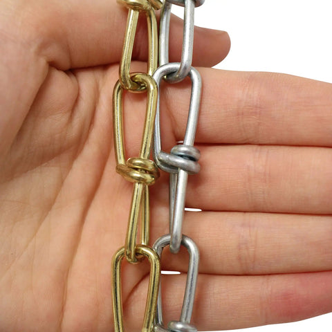 10 Gauge Decorative Solid Steel Double Loop Chain Sold By The Reel, 164 Feet, showing close-up of chain links held by hand