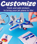 Person customizing Jet Plane Ace Wooden Model Kit for Kids 5 and Up Easy Build STEM Craft Set with glue and stickers