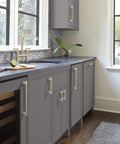 Contemporary Polished Nickel And Golden Champagne Cabinet Knob For Cabinets And Furniture, Esquire Series visible on kitchen cabinets.
