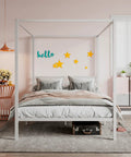 Full Size Canopy Bed Frame with Heavy Duty Metal Slats in White Four-Poster Style with bedding and pastel decor in a cozy bedroom.