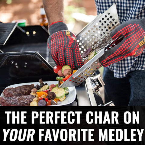Person using Premium Stainless Steel Grill Basket For Outdoor Grilling Extra Large Family Size Durable Veggies Fish Shrimp And Kebabs Basket Easy To Use With Sturdy Base For Even Heat And Safe Flipping Ideal BBQ Accessory on a barbecue grill with vegetables and meat.