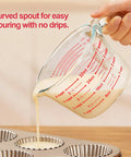 Pouring batter from 4-cup glass measuring jug into muffin tin. 6 Piece Glass Measuring Cup Set With Lids 1 Cup 2 Cup 4 Cup Nesting Jugs Borosilicate Glass Microwave Oven Freezer Safe Dishwasher Safe Clear Liquid Measuring Cups For Kitchen.