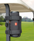 Go-To Golf Cart Speaker Mount With Adjustable Straps Bluetooth Wireless Holder on golf cart rail, black, outdoor setting.