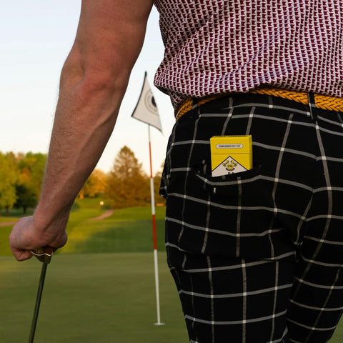Premium Bamboo Golf Tees 3.25 Inch Tall 18 Pack With Iconic Packaging Flip Open Pack in golfer's back pocket on course