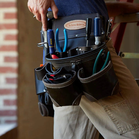 Durable Oil Tanned Leather Tool Rig With Large Capacity For Hand Tools And Fasteners Pro Grade Leather Tool Carrier Built For Pro Construction Jobs Easy Access Pocket Layout For Everyday Work displayed in use