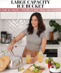 A woman using a Large Double Wall Stainless Steel Ice Bucket With Lid And Tongs BPA Free Drink Cooler on a marble countertop.