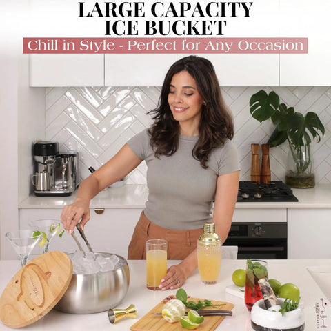 A woman using a Large Double Wall Stainless Steel Ice Bucket With Lid And Tongs BPA Free Drink Cooler on a marble countertop.