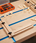 Woodworking setup with 10 Piece Super Grippy Black Wing Knobs With 1/4-20 Threads For T-Track Jigs and Feather Boards on a workbench.