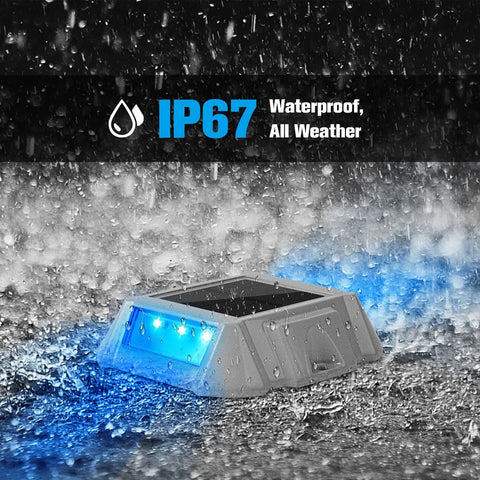 Blue LED Solar Deck Lights 12 Pack Waterproof Outdoor Lights For Driveway Dock Pathway, shown in rain proving IP67 rating