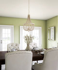 Dumas 3 Light Coastal Boho Chandelier With Weathered White Beads And Exposed Bulbs For A Cozy Vibe in dining room