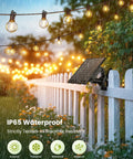 58 Foot Solar String Lights Outdoor With Remote Control, 26 LED Shatterproof Bulbs on a white fence in a rainy garden